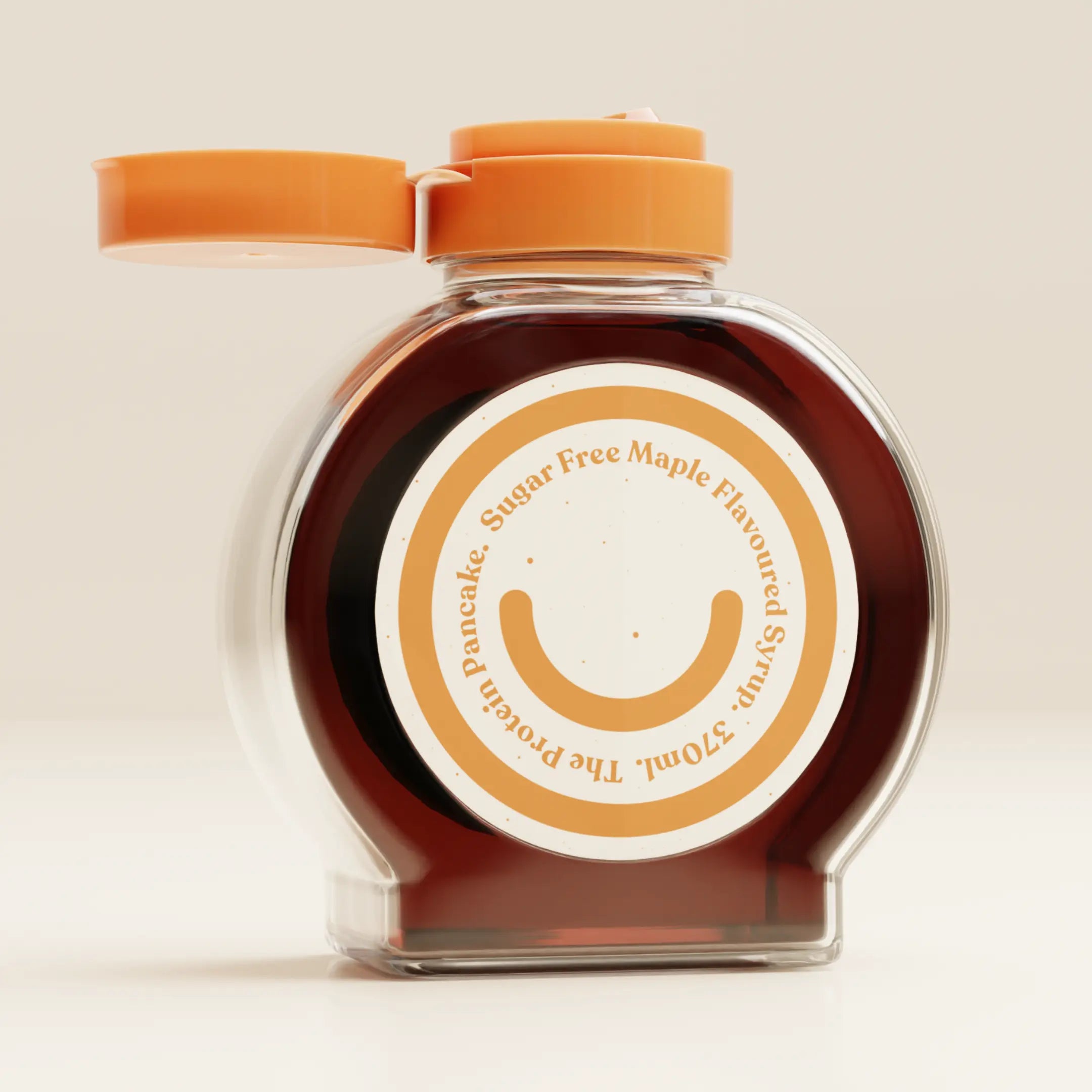 Jar of sugar-free maple-flavored syrup with an orange lid on a light background