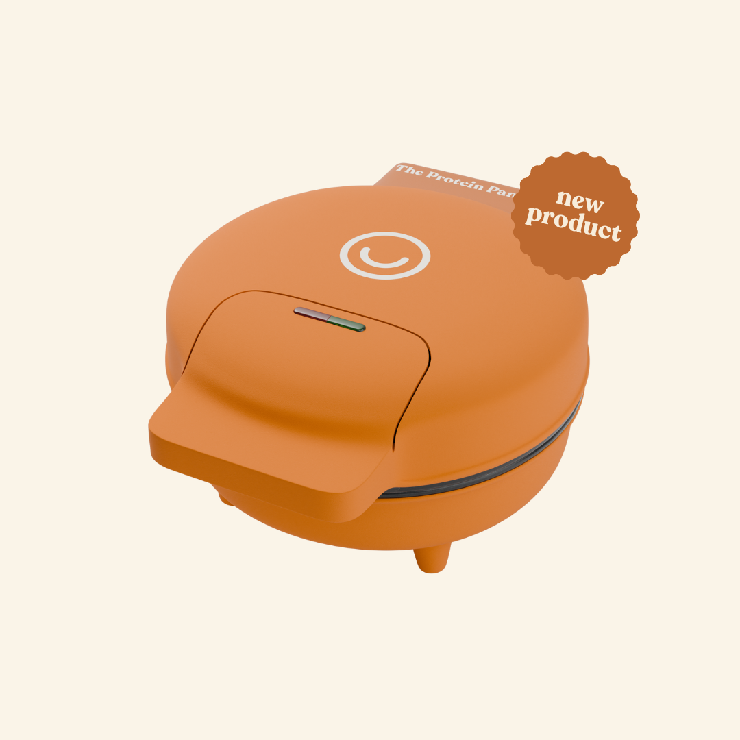 Orange waffle maker labeled 'new product' on a light background.