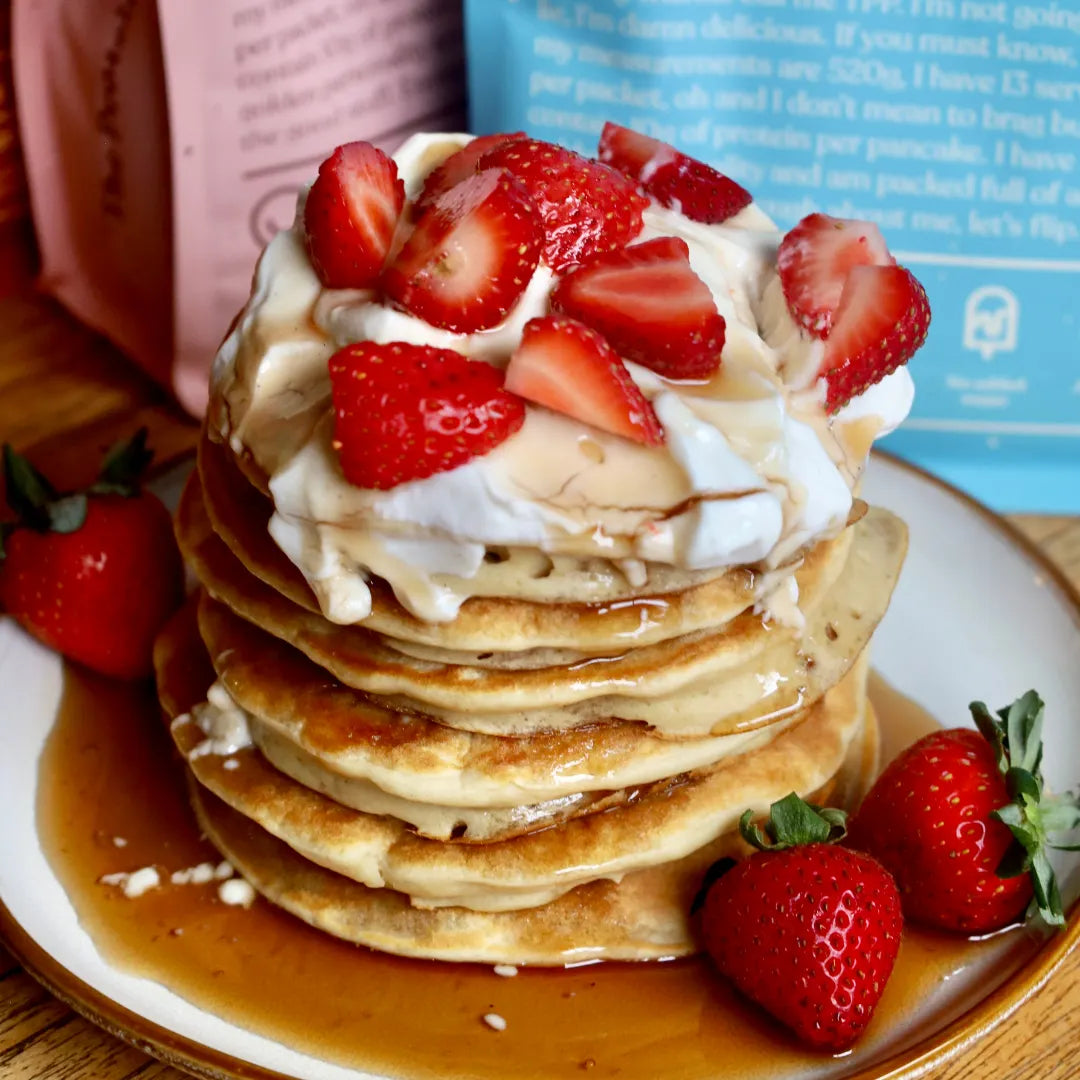 The Big Stack — strawberry and cream pancake stack with maple syrup