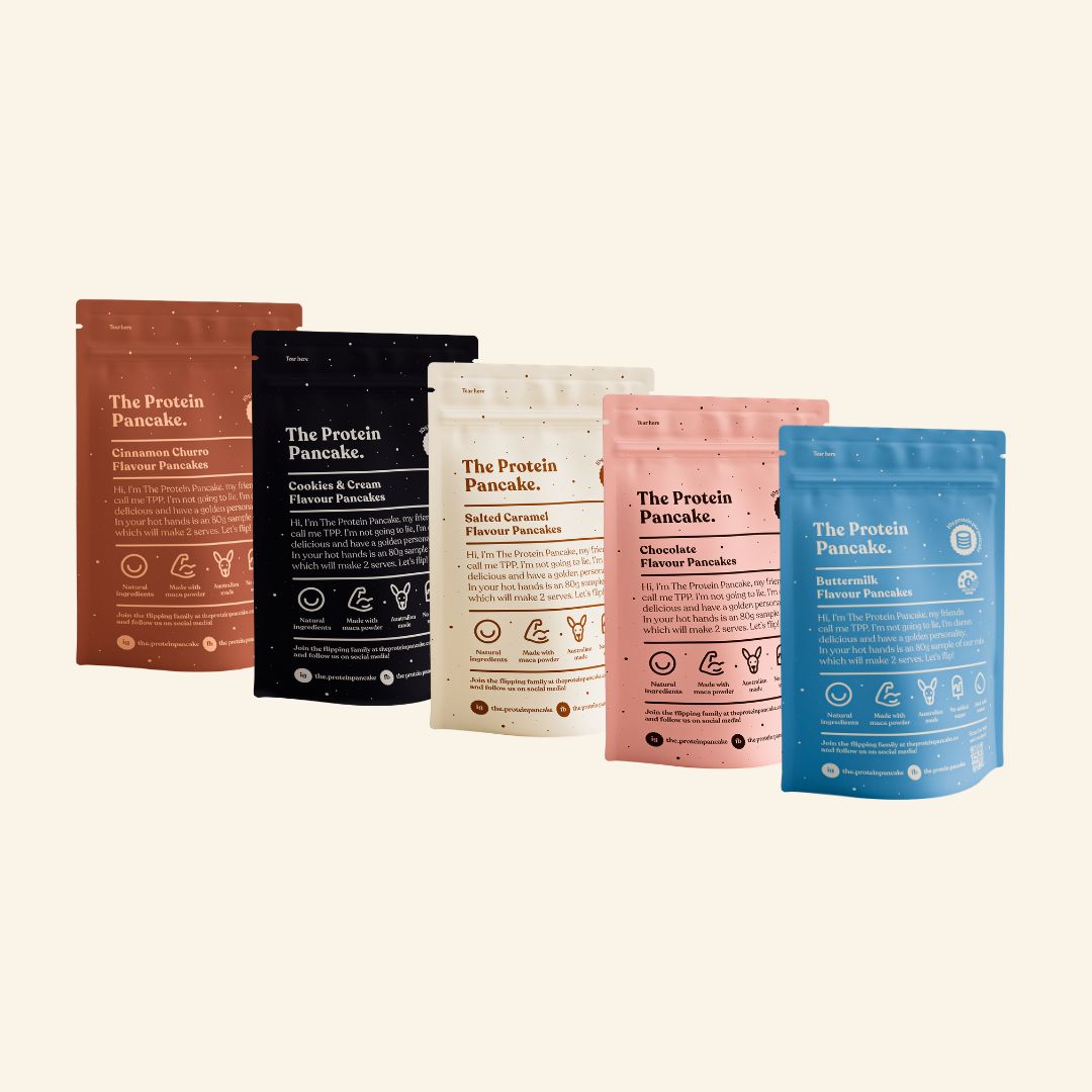 A variety of colorful protein pancake mix bags in different flavors.
